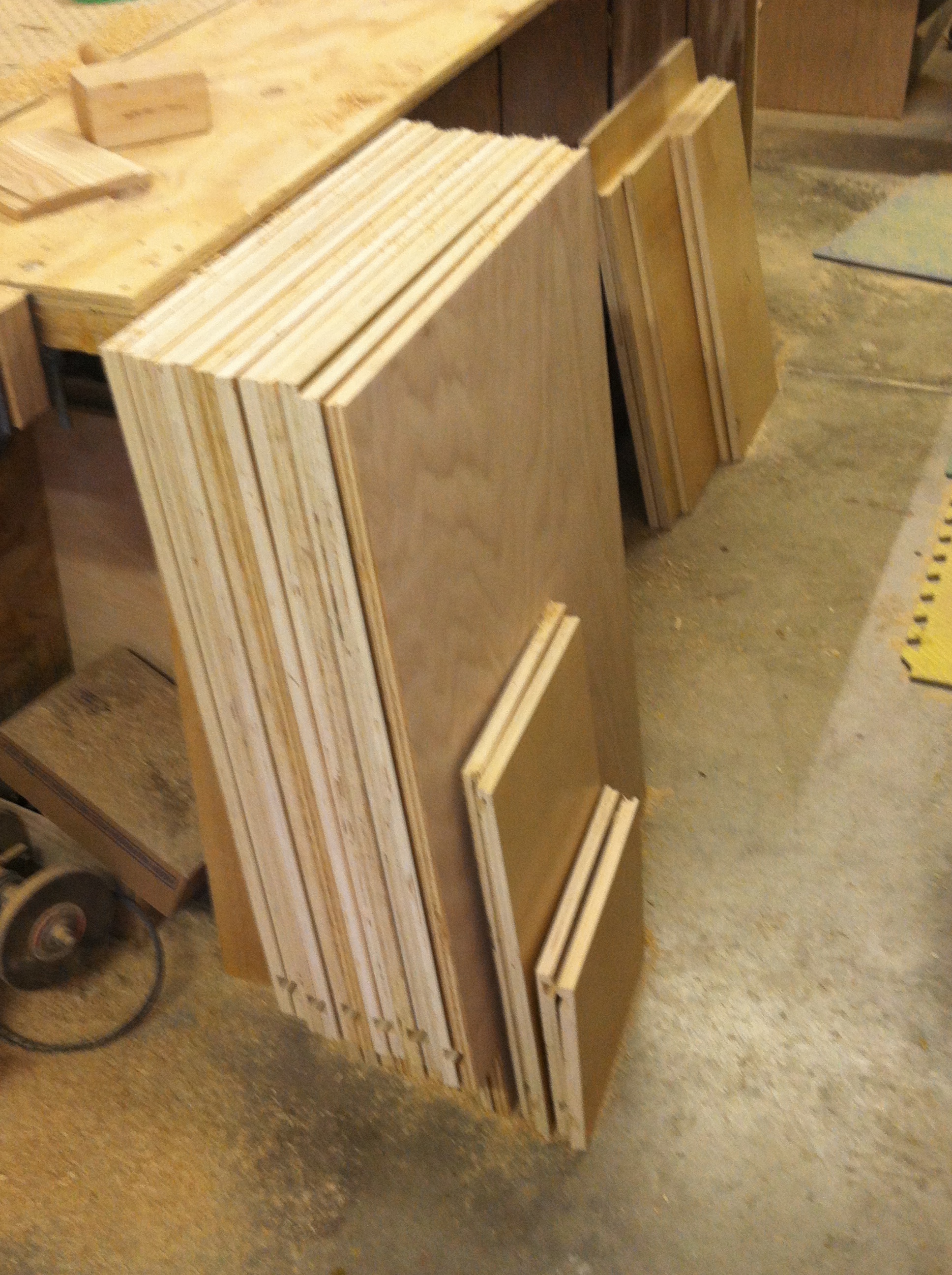  A stack of birch veneer plywood cut down to form kitchen cabinets.