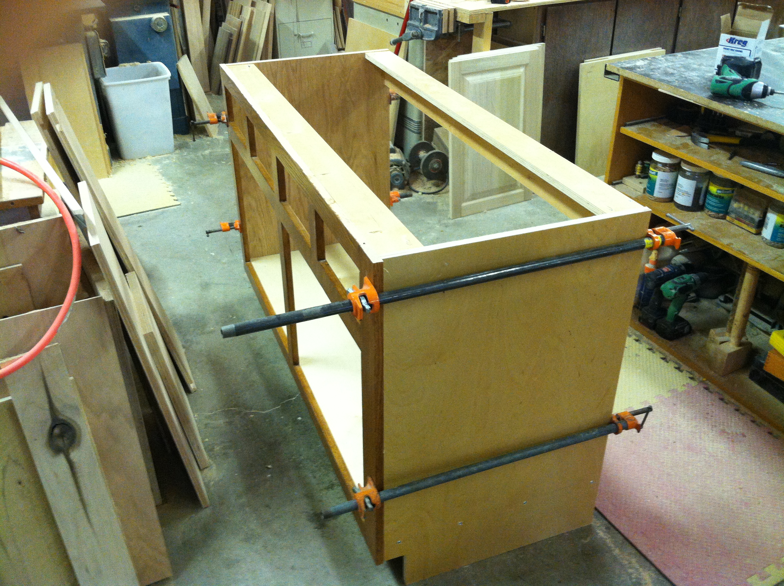 A kitchen cabinet being constructed.