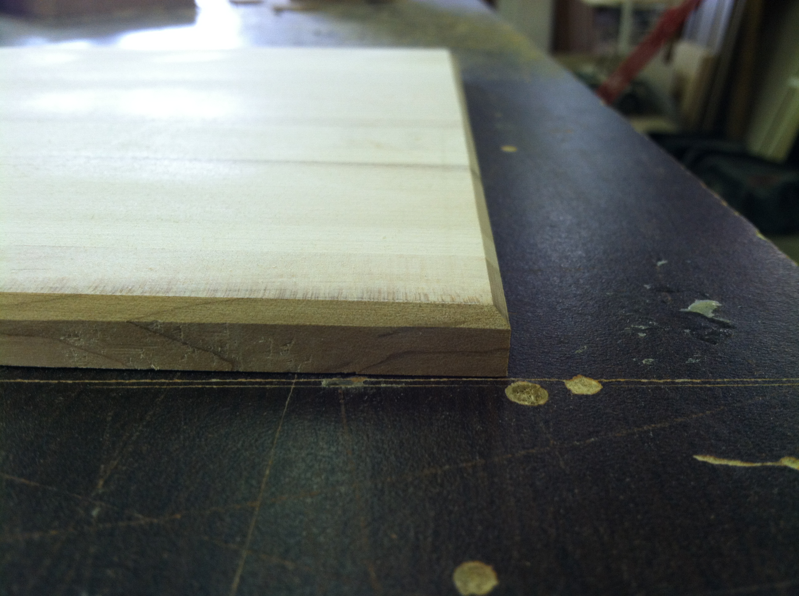 Maple wood glue with a beveled edges