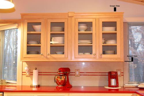 Maple kitchen cabinets 
   showcasing cabinet accent trim